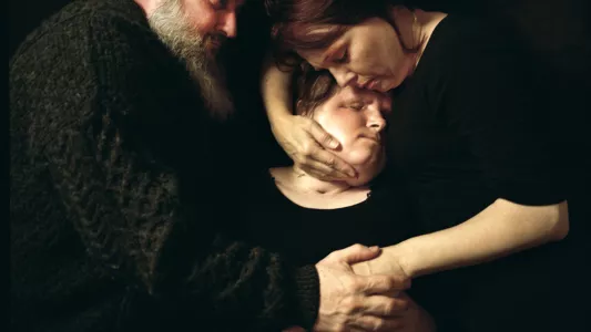 Maggie Steber 2018.  “Warrior Parents,” shows Robb and Alesia Stubblefield holding their daughter, Katie, months after Katie received a face transplant.