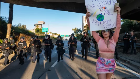 RAQUEL NATALICCHIO. Protestors marched northbound on the 110 freeway between 4th and Temple where they were met by law enforcement as they exited.