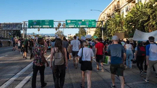 RAQUEL NATALICCHIO. Protestors marched northbound on the 110 freeway between 4th and Temple where they were met by law enforcement as they exited.